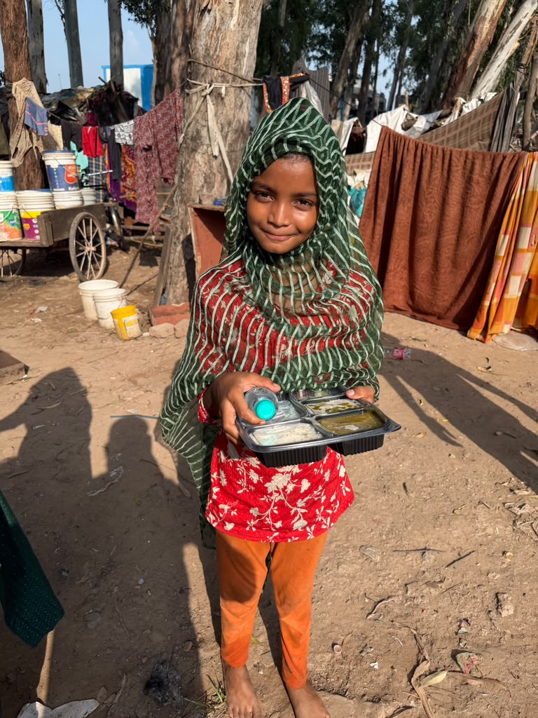 Young girl holding fresh nutritious meal tray